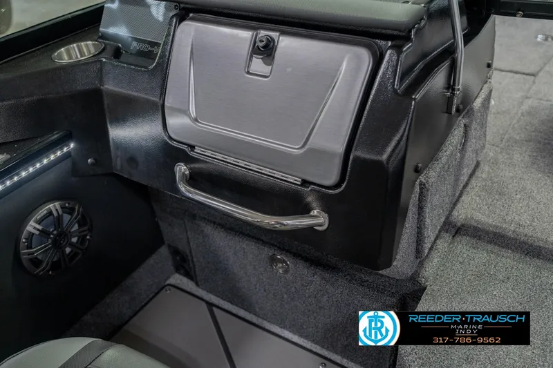 Slide: The Image of Interior of 2026 Lund 1975 Pro-V Sport boat with speaker and storage compartment. - 28