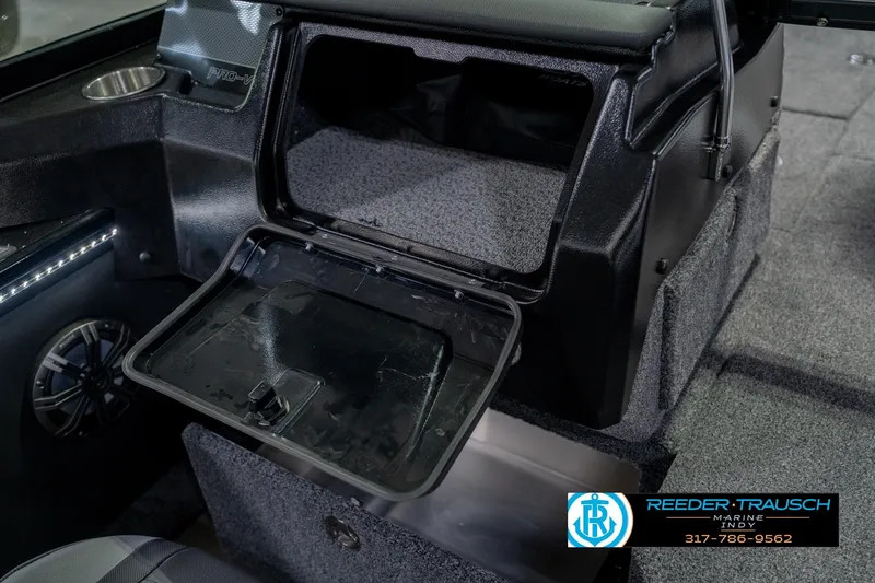 Slide: The Image of Interior of 2026 Lund 1975 Pro-V Sport boat with open storage compartment. - 29