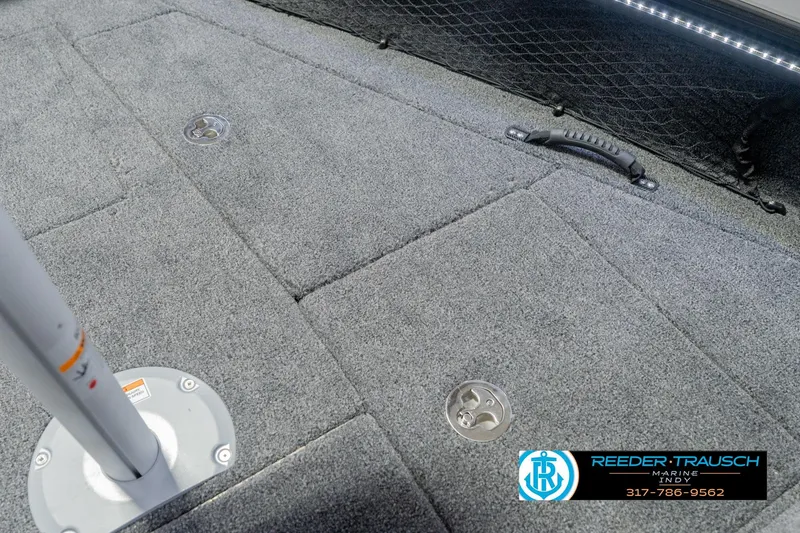 Slide: The Image of 2026 Lund 1975 Pro-V Sport boat deck with carpet, handle, and logo. - 32