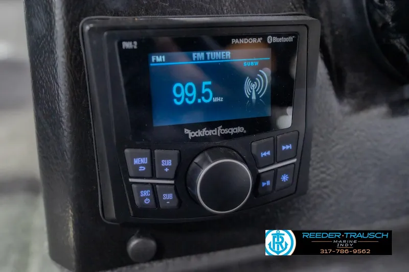 Slide: The Image of Rockford Fosgate radio display in 2026 Lund 1975 Pro-V Sport boat, showing FM 99.5 MHz. - 37