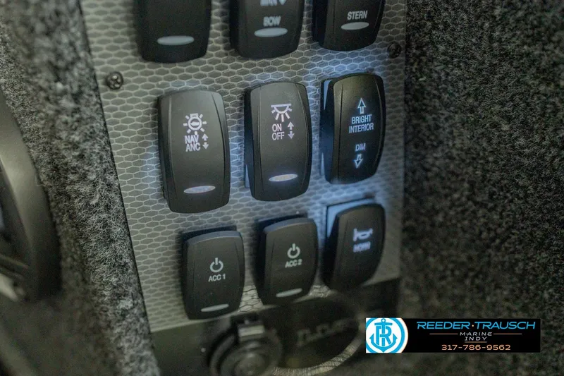 Slide: The Image of Control panel of 2026 Lund 1975 Pro-V Sport boat with labeled switches. - 42