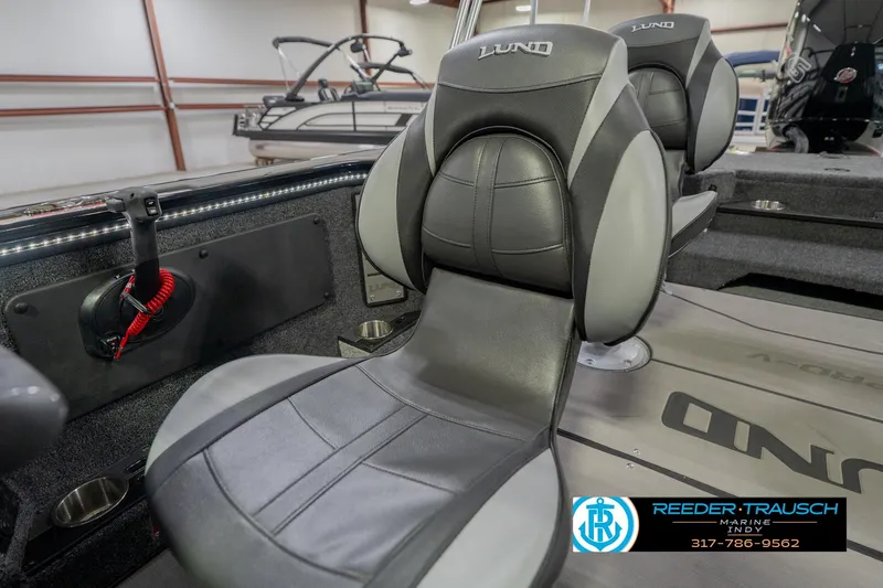 Slide: The Image of 2026 Lund 1975 Pro-V Sport boat interior with sleek seating and modern design. - 44