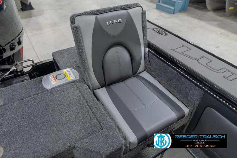 Slide: The Image of 2026 Lund 1975 Pro-V Sport boat seat with gray upholstery and branding details. - 47