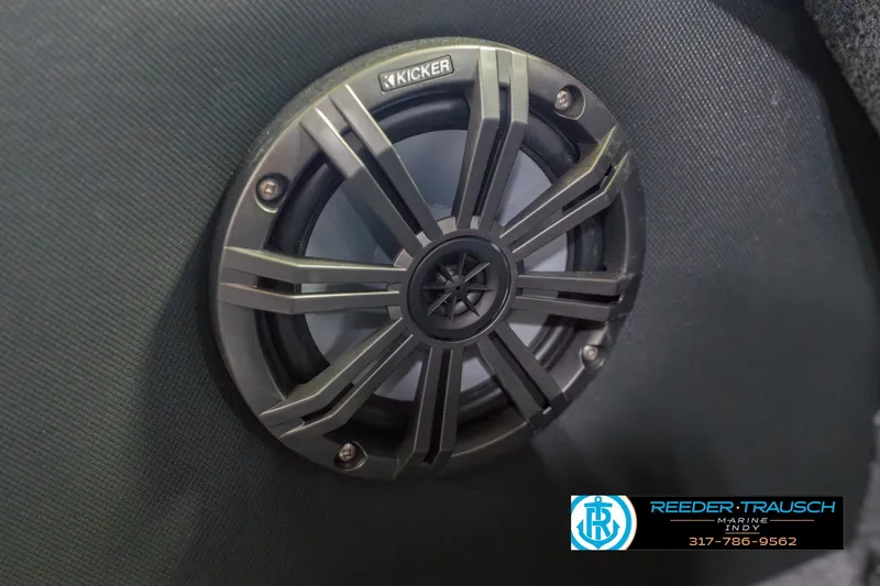 Slide: The Image of Kicker speaker in 2026 Lund 1975 Pro-V Sport boat, Reeder Trausch Marine logo visible. - 49