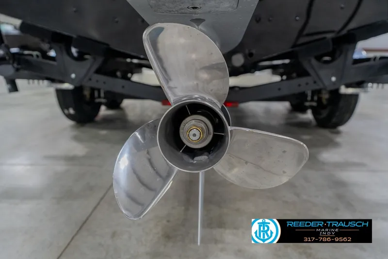 Slide: The Image of Propeller of 2026 Lund 1975 Pro-V Sport boat in showroom setting. - 56