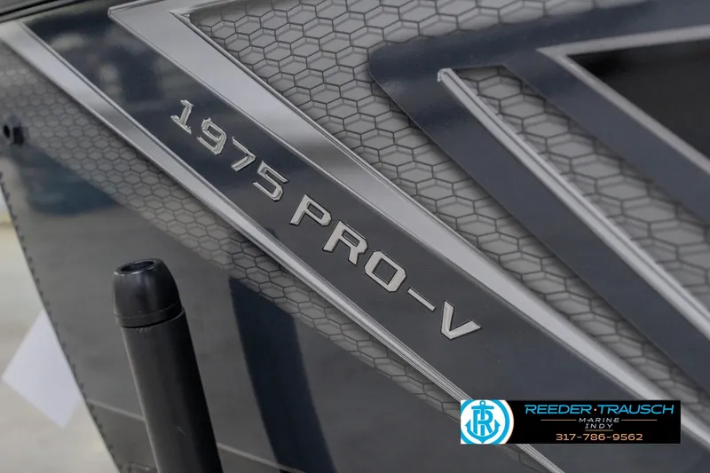 Slide: The Image of Close-up of 2026 Lund 1975 Pro-V Sport boat model branding. - 58