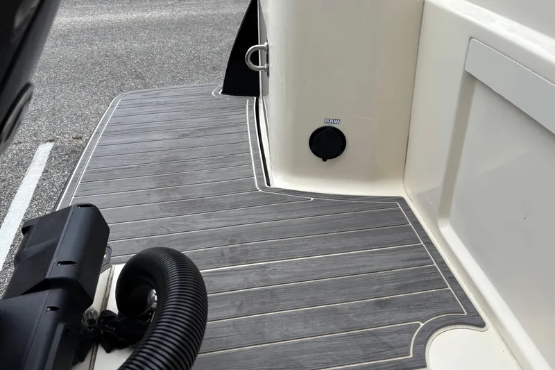 Slide: The Image of 2026 Scout 240 Dorado boat deck with sleek, modern design and raw water access. - 11