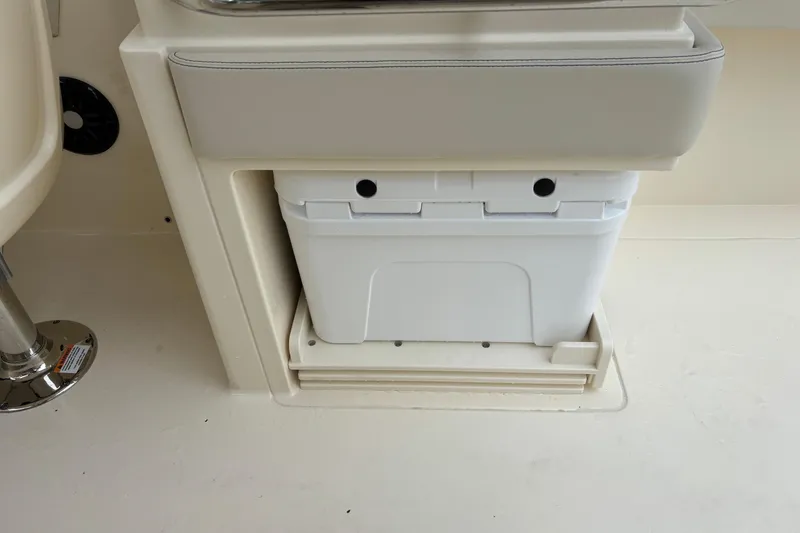 Slide: The Image of 2026 Scout 240 Dorado boat interior with built-in cooler storage. - 20