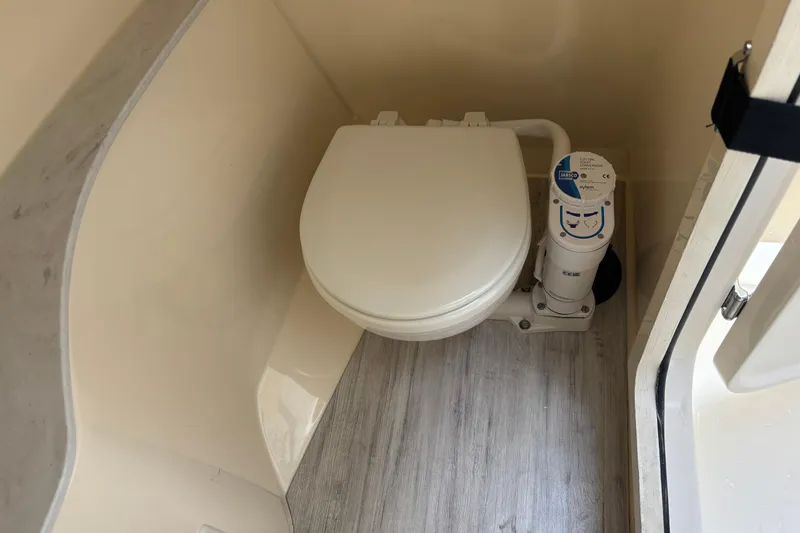 Slide: The Image of 2026 Scout 240 Dorado boat bathroom with compact marine toilet. - 33