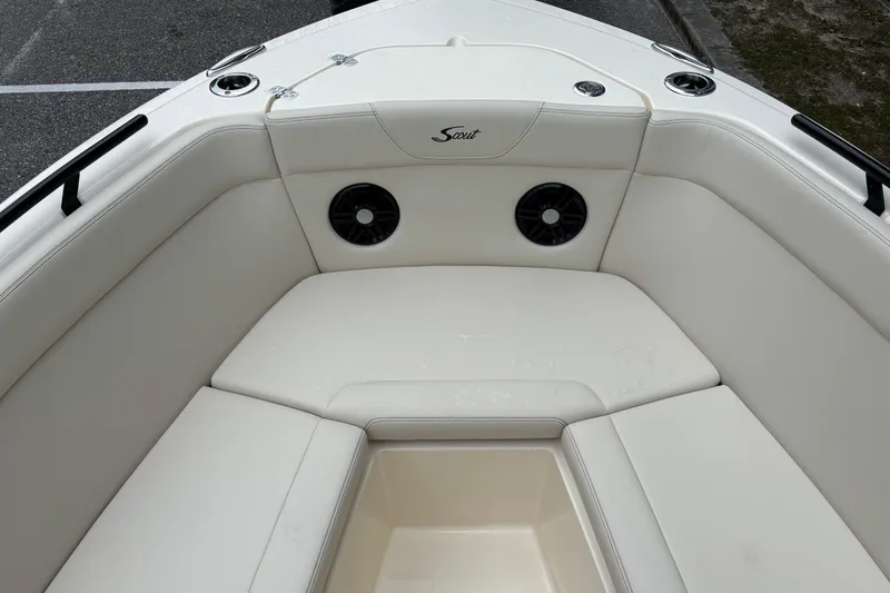 Slide: The Image of 2026 Scout 240 Dorado boat interior with white seating and built-in speakers. - 37