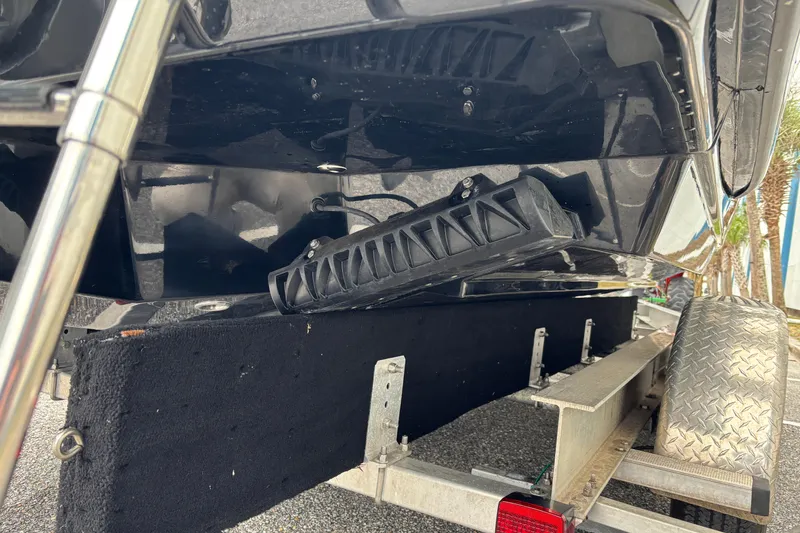 Slide: The Image of 2026 Scout 240 Dorado boat on trailer, showing hull and support structure. - 6