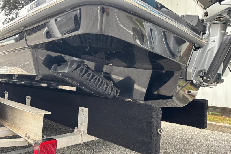 Slide: The Image of 2026 Scout 240 Dorado boat on trailer, close-up of hull and motor. - 7