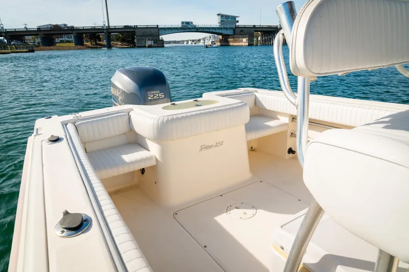 Slide: The Image of 2005 Sea Hunt Triton 232 boat with Yamaha 225 engine on calm water. - 16