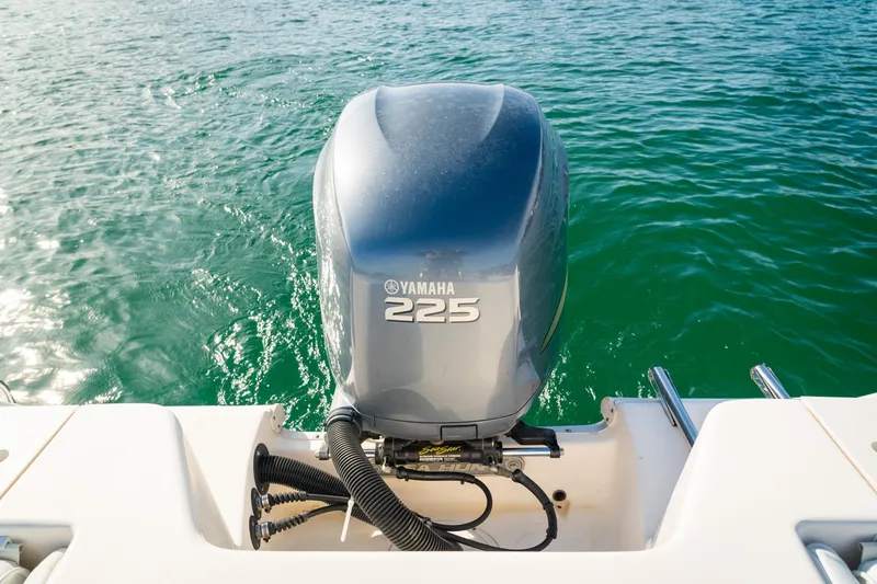 Slide: The Image of 2005 Sea Hunt Triton 232 with Yamaha 225 outboard motor on clear water. - 24