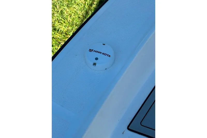 Slide: The Image of Minn Kota component on 1998 Sea Strike 18 CC boat deck, close-up view. - 10