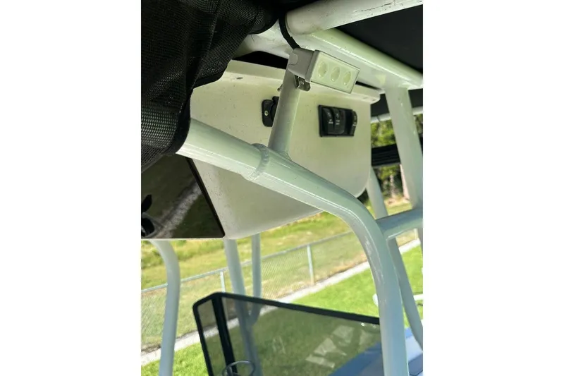 Slide: The Image of 1998 Sea Strike 18 CC boat interior with white framework and control panel. - 14