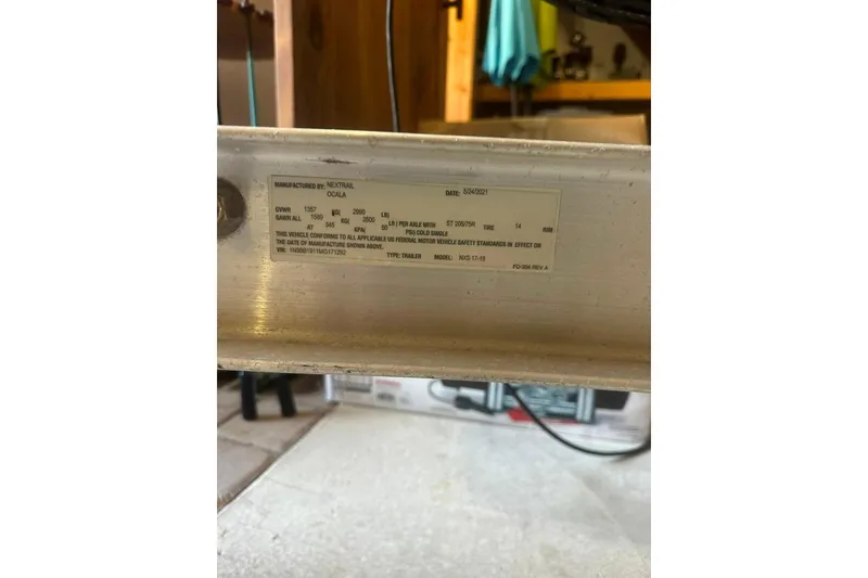 Slide: The Image of Label on a Sea Strike 18 CC boat trailer, manufactured by Nextrail, dated 5/24/2021. - 19