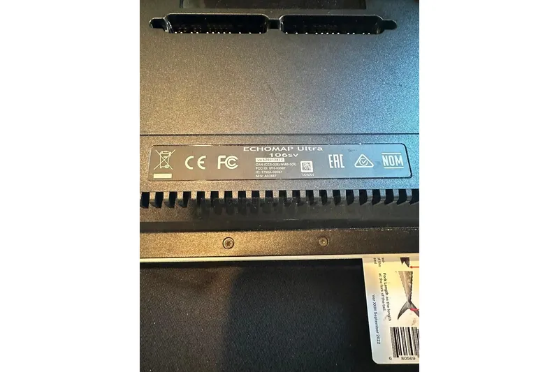 Slide: The Image of Label on Garmin ECHOMAP Ultra 106sv device, showing certifications and model details. - 21