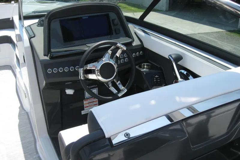 Slide: The Image of 2025 Monterey 278SS Super Sport boat interior with sleek seating and storage compartment. - 10