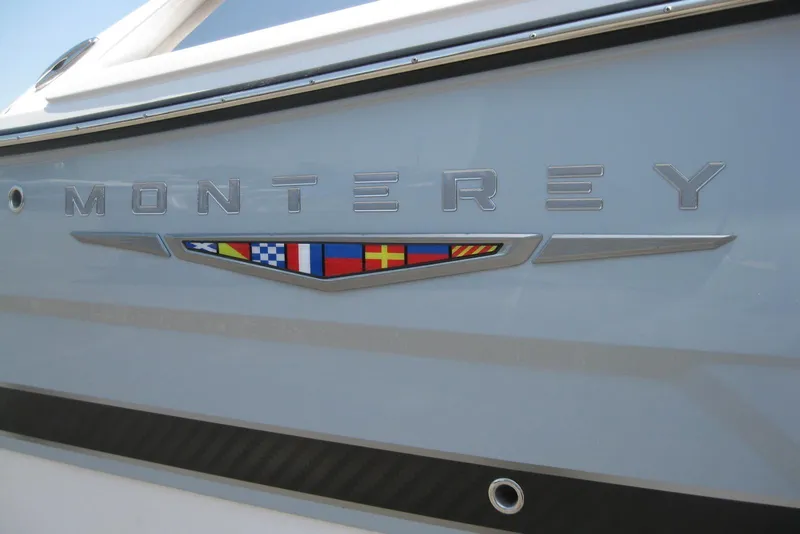 Slide: The Image of 2025 Monterey 278SS Super Sport boat on display outdoors, side view. - 2