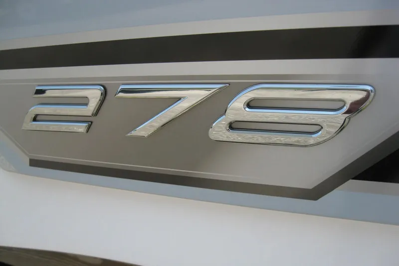 Slide: The Image of 2025 Monterey 278SS Super Sport boat emblem with nautical flags. - 3