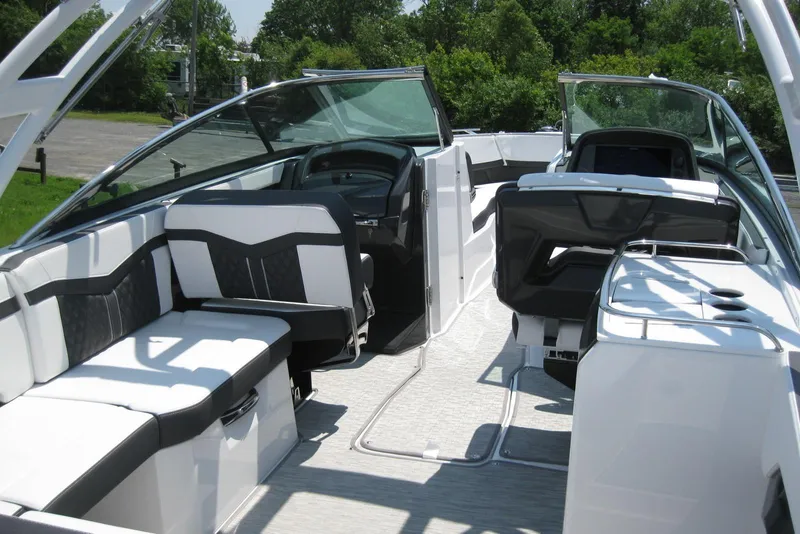 Slide: The Image of 2025 Monterey 278SS Super Sport boat, rear view with sleek design and spacious seating. - 6