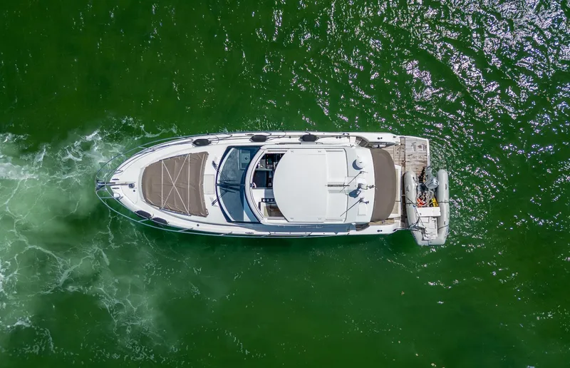 Slide: The Image of Aerial view of 2019 Jeanneau Leader 40 yacht cruising on green water. - 11
