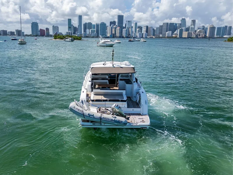 Slide: The Image of 2019 Jeanneau Leader 40 yacht cruising near city skyline on a sunny day. - 17