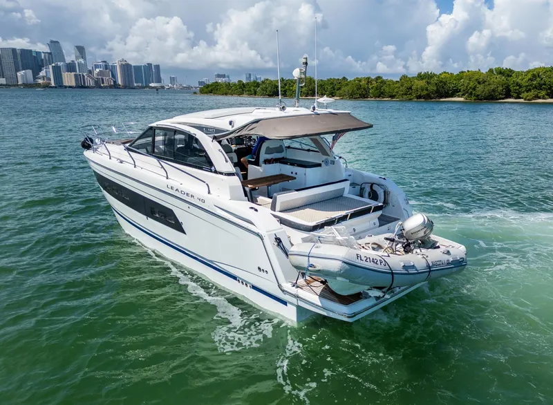 Slide: The Image of 2019 Jeanneau Leader 40 yacht cruising in scenic coastal waters. - 23