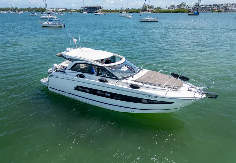Slide: The Image of 2019 Jeanneau Leader 40 yacht cruising on a sunny day in a scenic bay. - 26