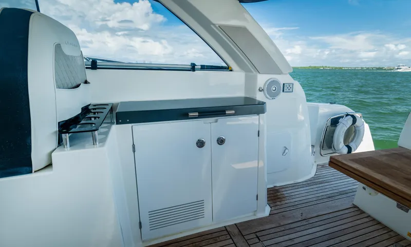 Slide: The Image of 2019 Jeanneau Leader 40 yacht interior with sleek cabinetry and ocean view. - 43