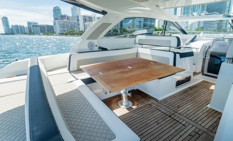 Slide: The Image of Luxurious 2019 Jeanneau Leader 40 yacht interior with elegant seating and wooden table. - 47