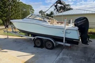 The Image of 2020 Scout 215 Dorado boat on trailer with Mercury outboard motor. - 1