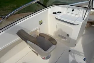 Slide: The Image of 2020 Scout 215 Dorado boat interior with seating and storage compartments. - 12