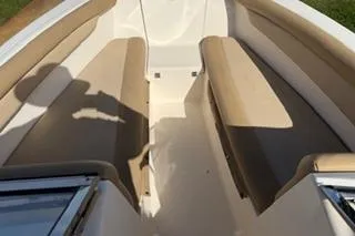 Slide: The Image of 2020 Scout 215 Dorado boat interior with beige seating and white deck. - 14