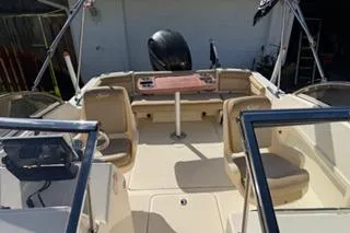 Slide: The Image of 2020 Scout 215 Dorado boat interior with seating and steering console. - 18