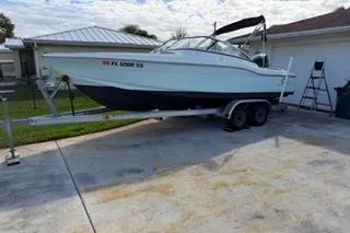 Slide: The Image of 2020 Scout 215 Dorado boat on trailer in driveway, ready for transport. - 3