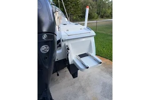 Slide: The Image of 2020 Scout 215 Dorado boat with swim platform and ladder, parked on concrete. - 5