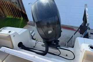 Slide: The Image of 2020 Scout 215 Dorado boat engine, outdoor setting, close-up view. - 8