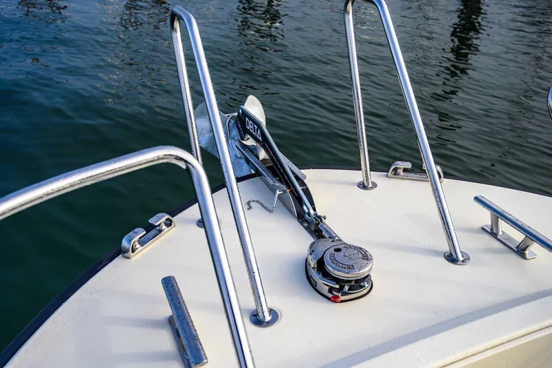 Slide: The Image of Bow of 2020 Targa 32 boat with anchor and railing on calm water. - 11