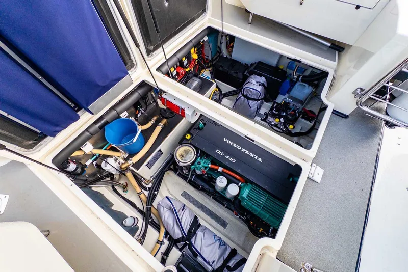 Slide: The Image of Engine compartment of a 2020 Targa 32 boat featuring a Volvo Penta D6-440 engine. - 13
