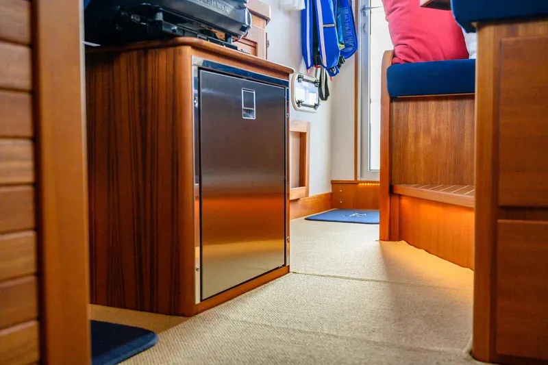 Slide: The Image of Interior of 2020 Targa 32 boat with wooden cabinetry and modern design. - 27