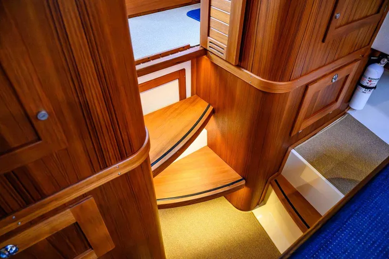 Slide: The Image of Interior of 2020 Targa 32 boat with wooden stairs and cabinetry. - 32