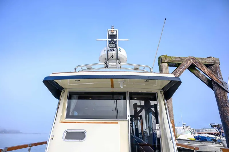 Slide: The Image of Targa 32 boat, 2020 model, docked with clear blue sky background. - 5