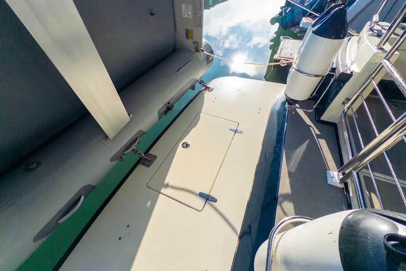 Slide: The Image of 2020 Targa 32 boat deck with storage hatch and safety railings. - 6