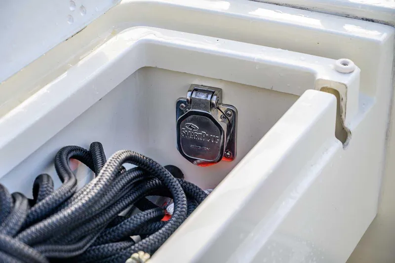 Slide: The Image of Targa 32 (2020) boat compartment with SmartPlug and coiled rope. - 7