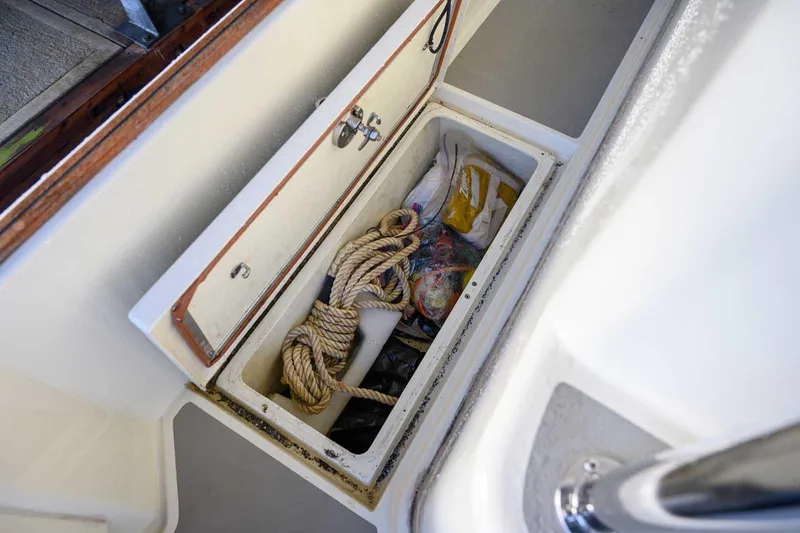 Slide: The Image of Storage compartment on 2020 Targa 32 boat with rope and supplies. - 8