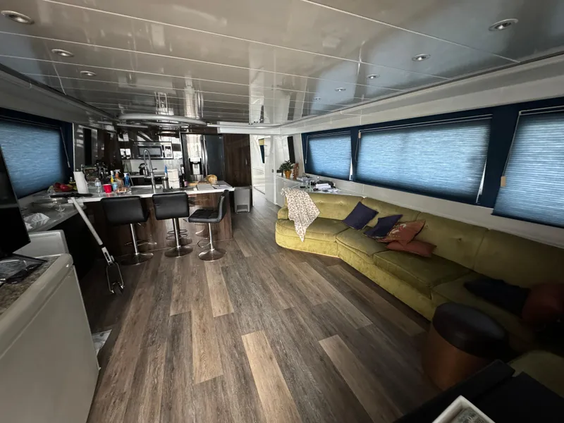 Slide: The Image of Luxurious interior of 1990 Versilcraft Challenger Motor Yacht with modern furnishings and spacious layout. - 11