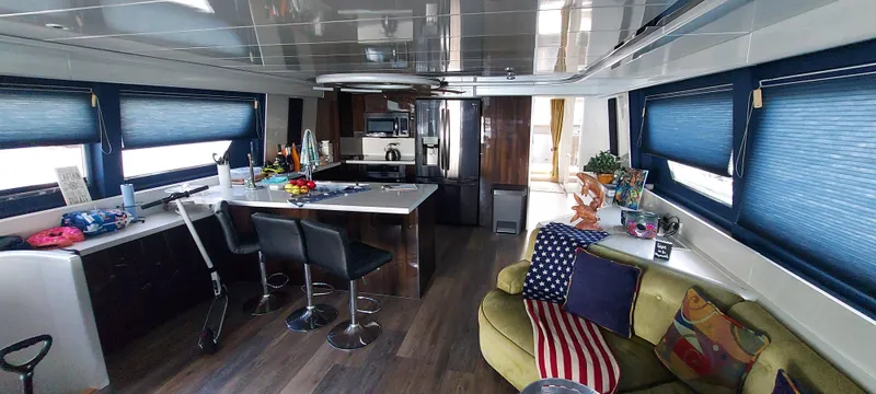 Slide: The Image of Luxurious interior of 1990 Versilcraft Challenger Motor Yacht with modern kitchen and seating area. - 13