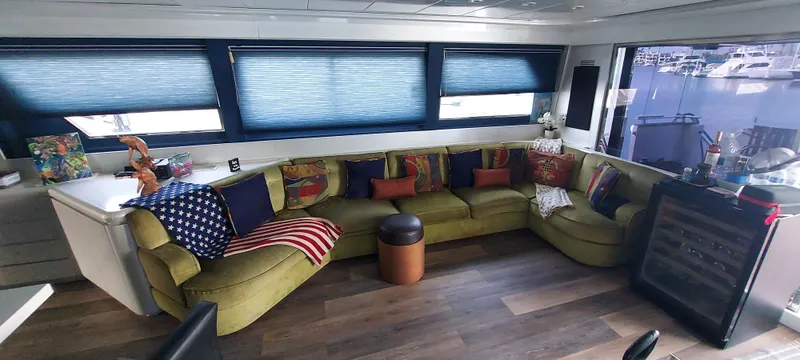 Slide: The Image of Luxurious 1990 Versilcraft Challenger yacht interior with plush seating and vibrant decor. - 14